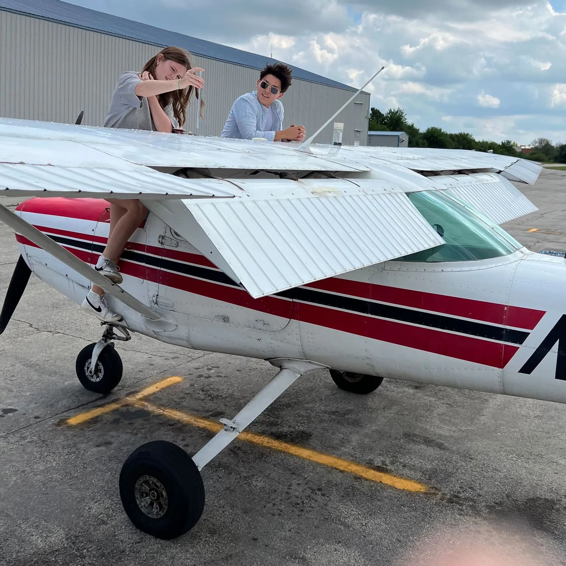 Students checking fuel on a Cessna 152